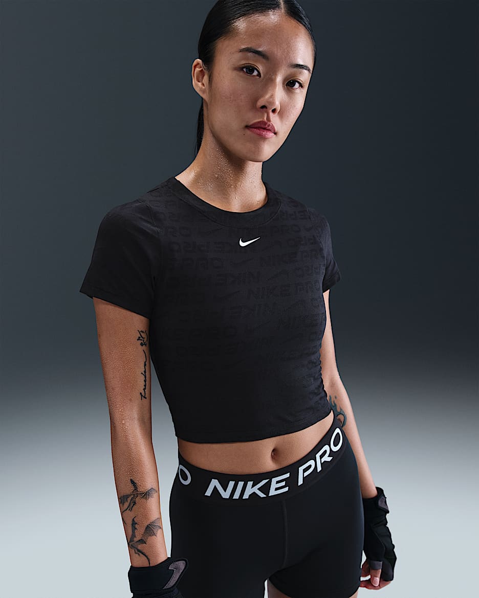 เสื้อเอวลอยแขนสั้นผ้าแจ็คการ์ดผู้หญิง Dri-FIT Nike Pro - ดำ/ขาว