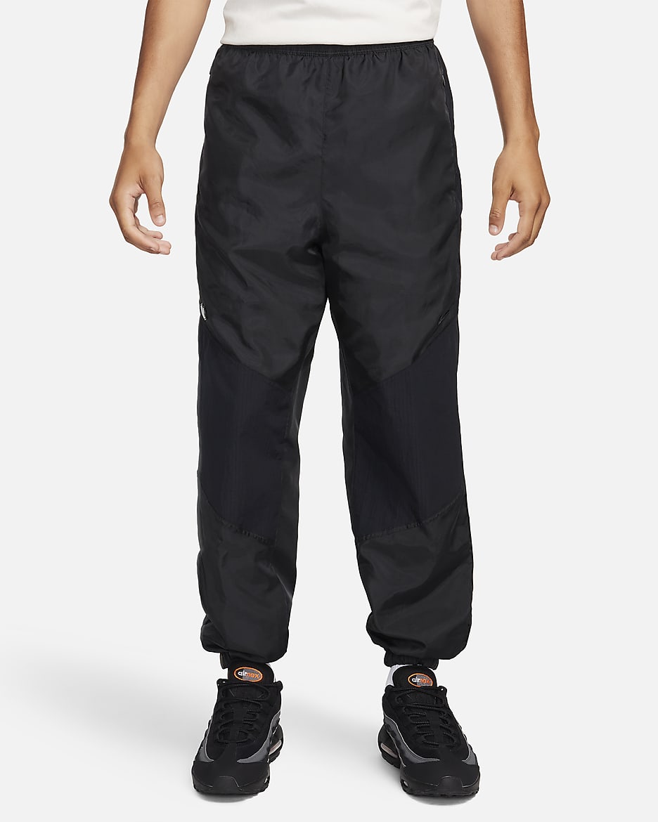 Pantaloni in tessuto Nike Sportswear – Uomo - Nero/Nero