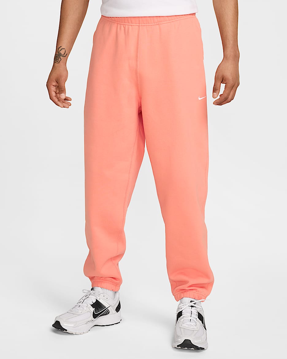 Pants de tejido Fleece para hombre Nike Solo Swoosh - Ágata melocotón/Blanco