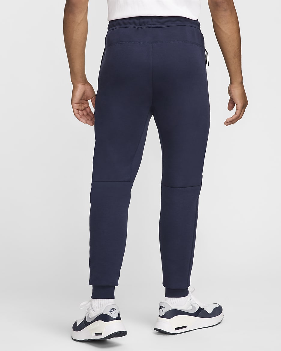 Chelsea F.C. Tech Fleece Men's Nike Football Joggers - Obsidian/Guava Ice