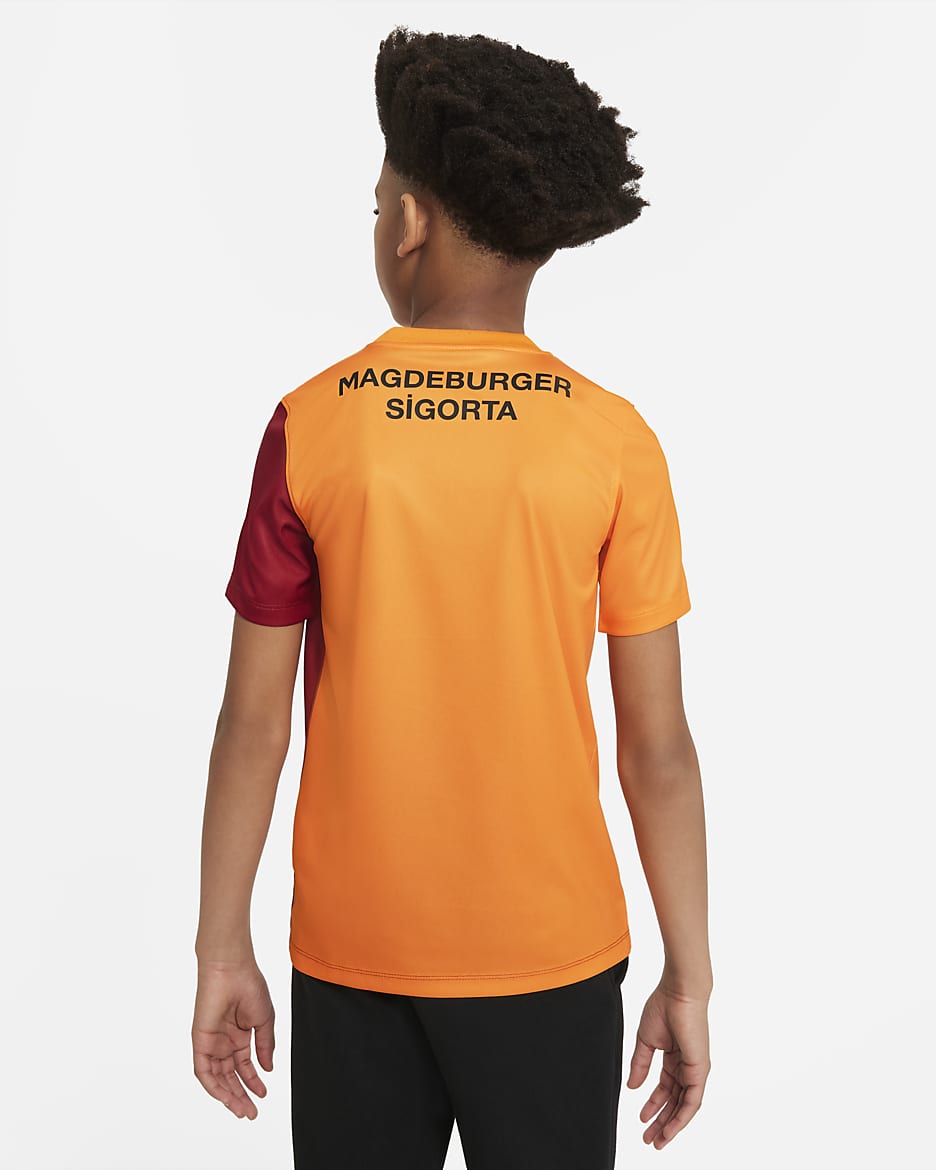 Galatasaray Home Kurzarm-Fußballoberteil für ältere Kinder - Vivid Orange/Pepper Red/Pepper Red