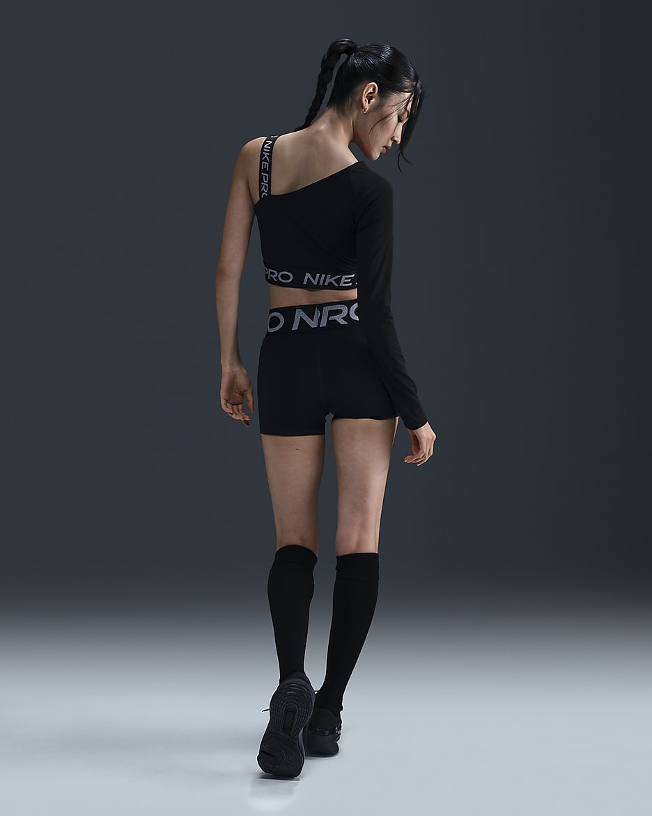 Nike Pro Shine asymmetrische croptop met Dri-FIT voor dames - Zwart