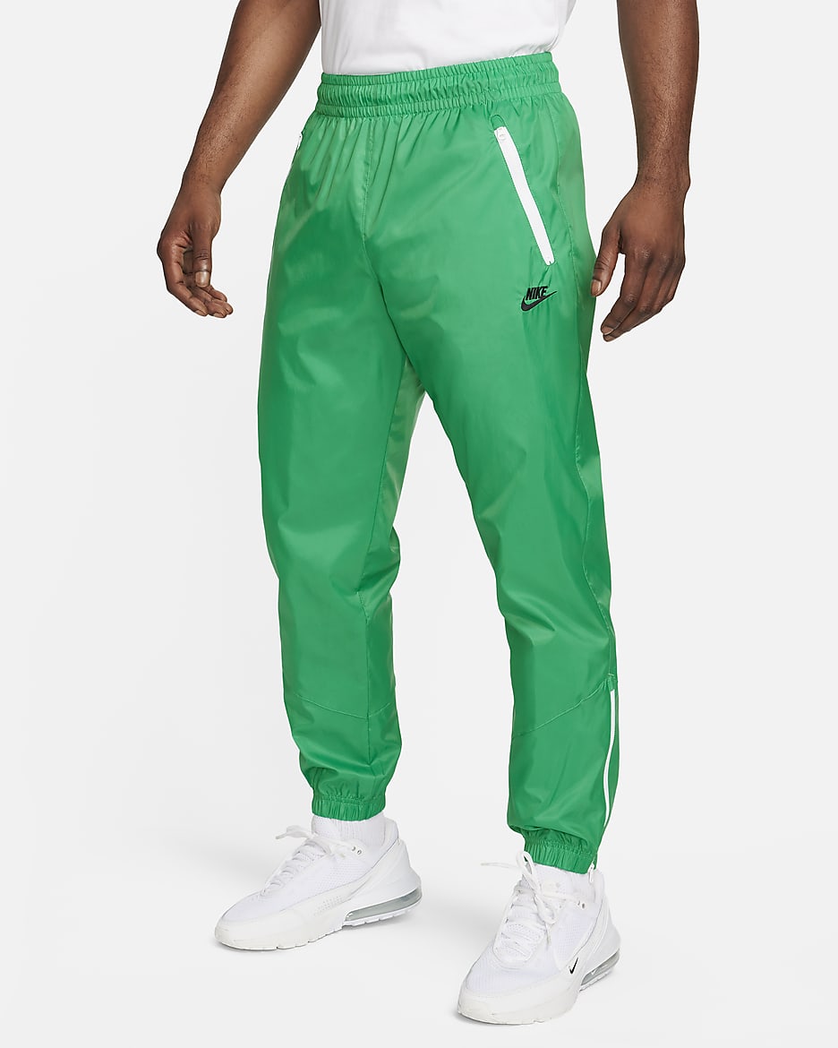 Pantalon doublé en tissu tissé Nike Windrunner pour homme - Stadium Green/Noir