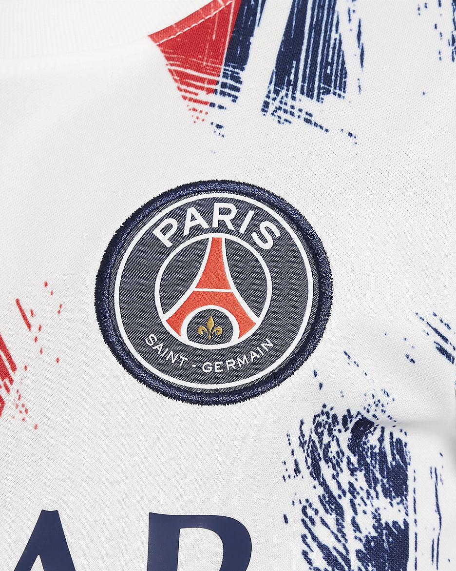 Paris Saint-Germain Academy Pro idegenbeli Nike Dri-FIT mérkőzés előtti, rövid ujjú futballfelső nagyobb gyerekeknek - Fehér/Midnight Navy/Midnight Navy