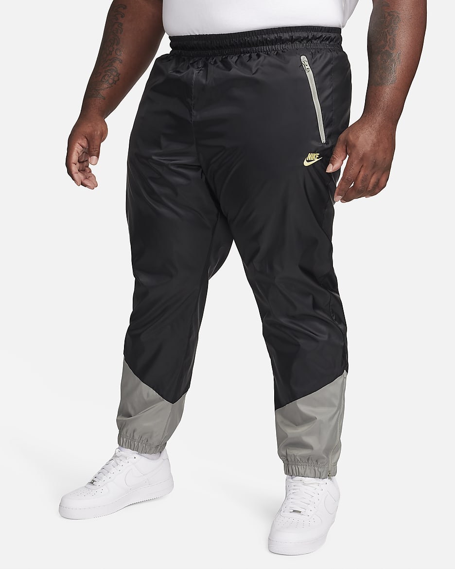 Pantalon doublé en tissu tissé Nike Windrunner pour homme - Noir/Dark Stucco/Saturn Gold