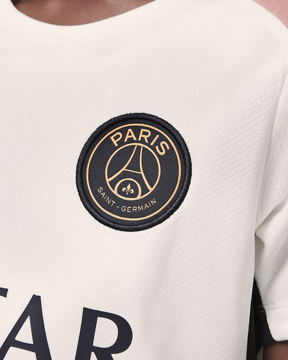 Dzianinowa koszulka piłkarska z krótkim rękawem dla dużych dzieci Jordan Dri-FIT Paris Saint-Germain Strike (wersja trzecia) - Pale Ivory/Czerń/Rust Pink/Czerń