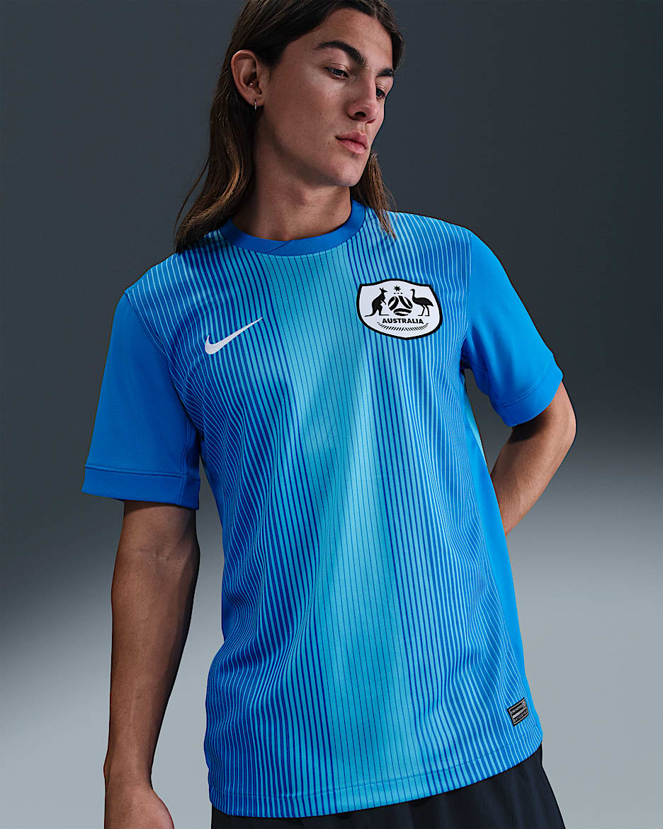 Replika pánského brankářského fotbalového dresu Nike Dri-FIT Austrálie Stadium 2025/26 s krátkým rukávem - Photo Blue/Baltic Blue/Bílá