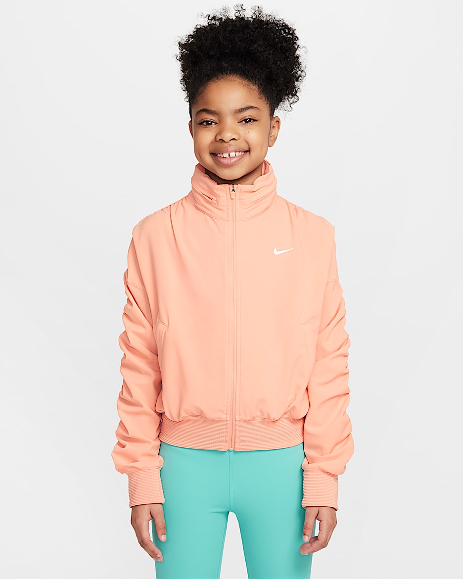 เสื้อแจ็คเก็ตน้ำหนักเบาเด็กหญิง Dri-FIT Nike - Apricot Agate/ขาว
