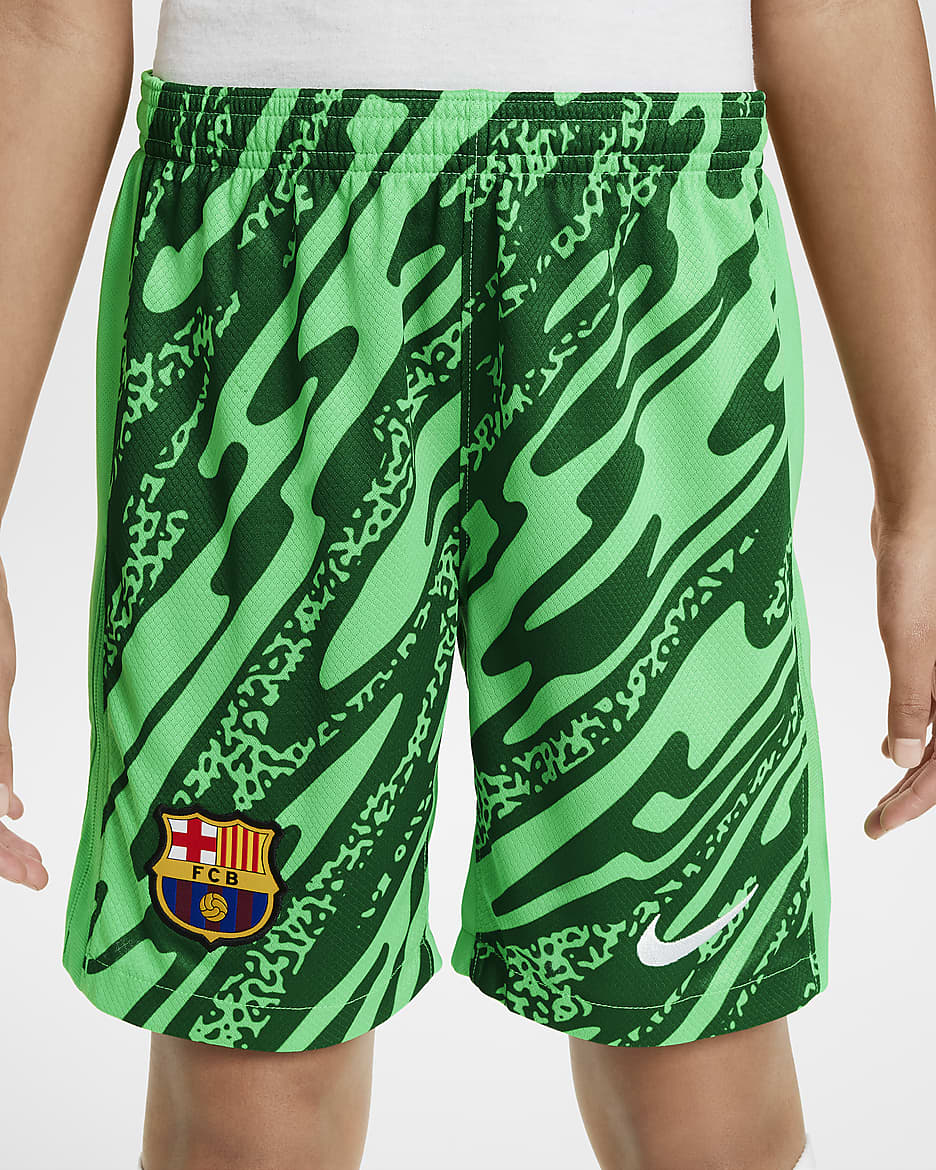 Spodenki piłkarskie dla dużych dzieci Nike Dri-FIT FC Barcelona Stadium Goalkeeper 2024/25 – replika - Green Spark/Pine Green/Biel