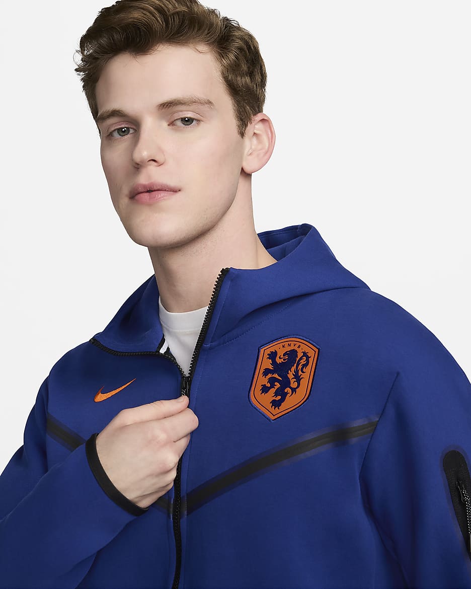 Pánská fotbalová mikina Nike Nizozemsko Tech Fleece Windrunner s kapucí a zipem po celé délce - Deep Royal Blue/Safety Orange