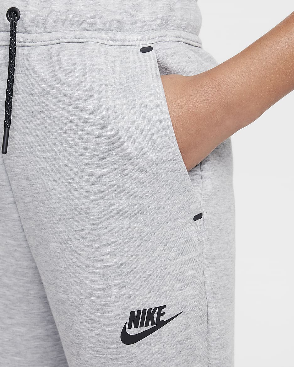 Běžecké kalhoty Nike Sportswear Tech Fleece pro větší děti (dívky) - Dark Grey Heather/Černá/Černá/Černá