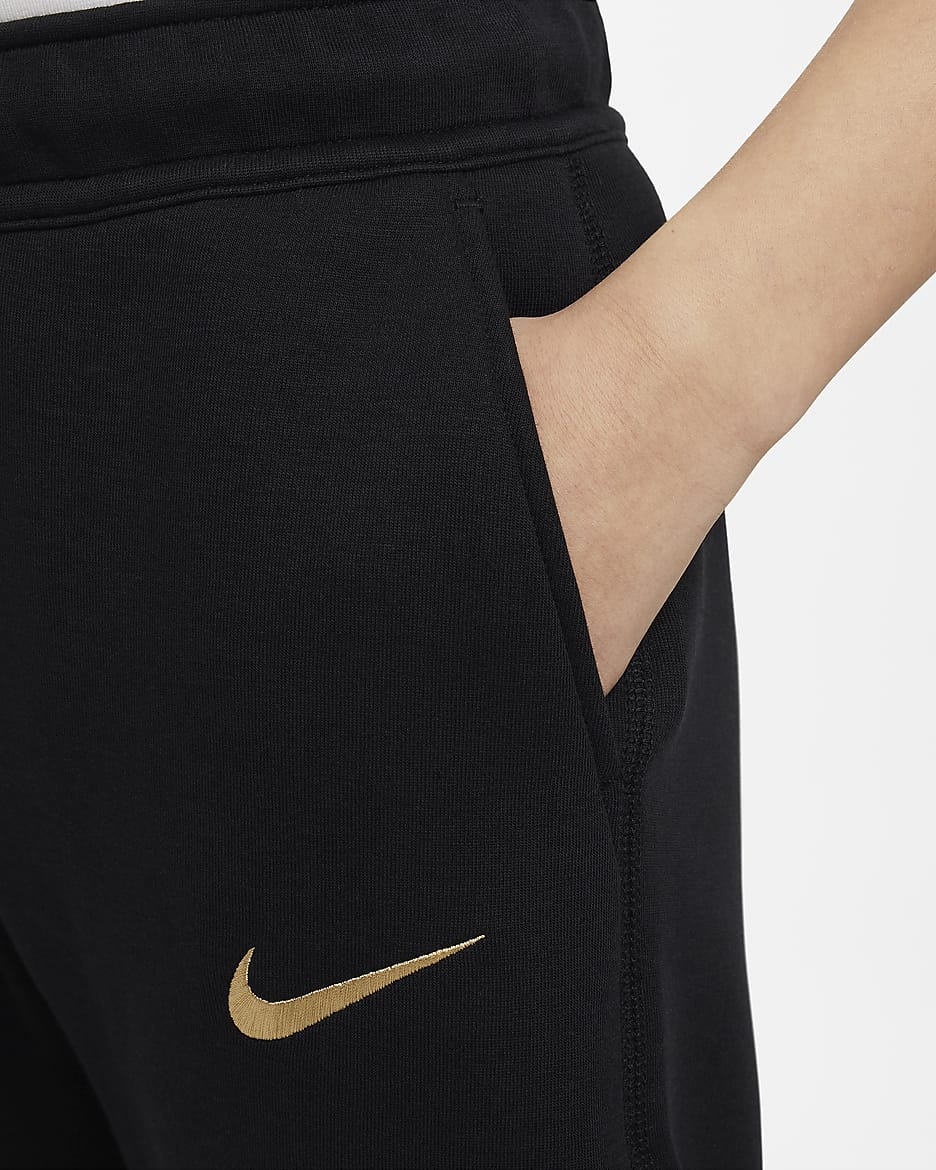 FC Barcelona Tech Fleece Nike-fodboldbukser til større børn (drenge) - sort/Club Gold