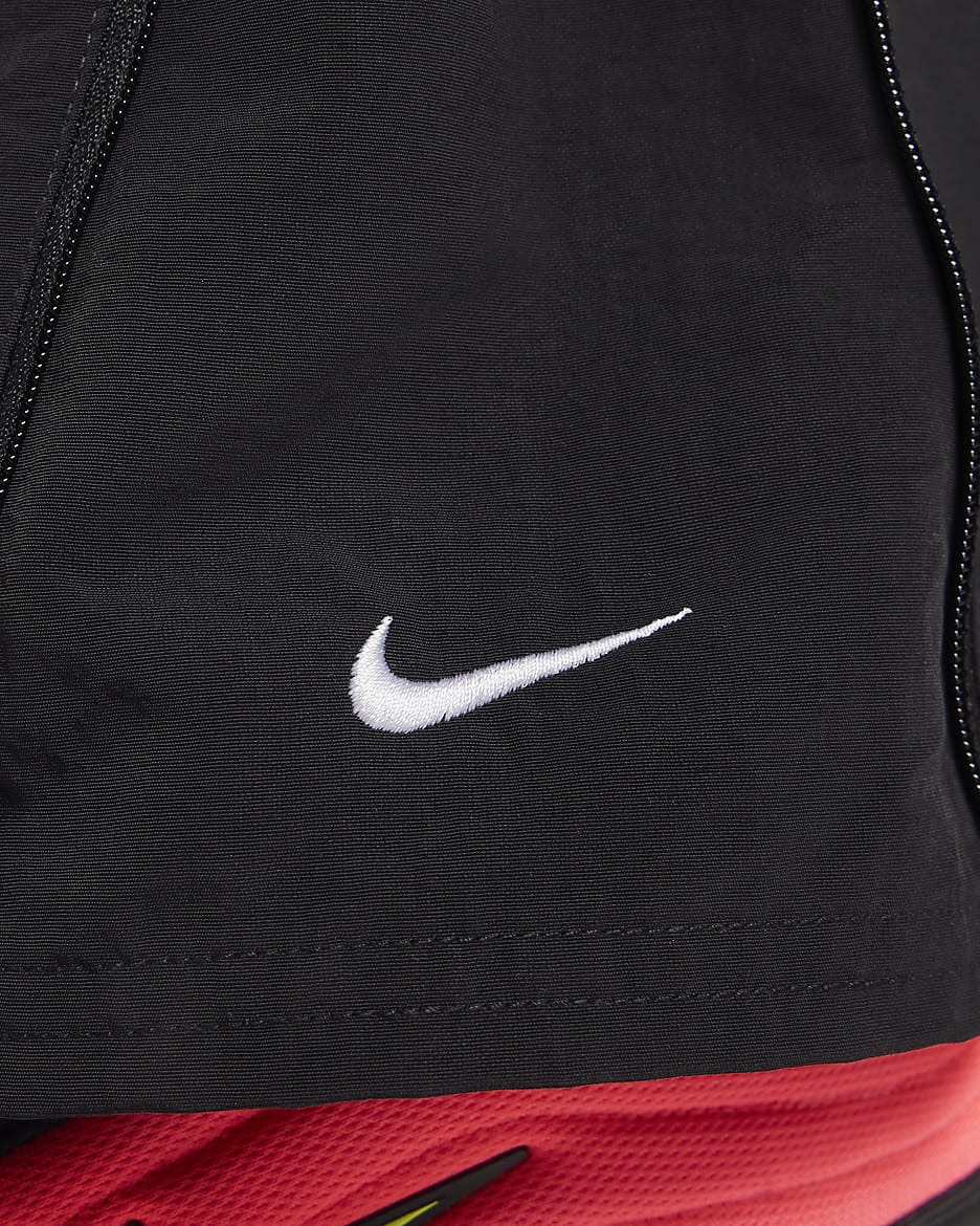 Pantaloni a vita alta in tessuto UV con orlo aperto e zip Nike Sportswear Essential – Donna - Nero/Bianco