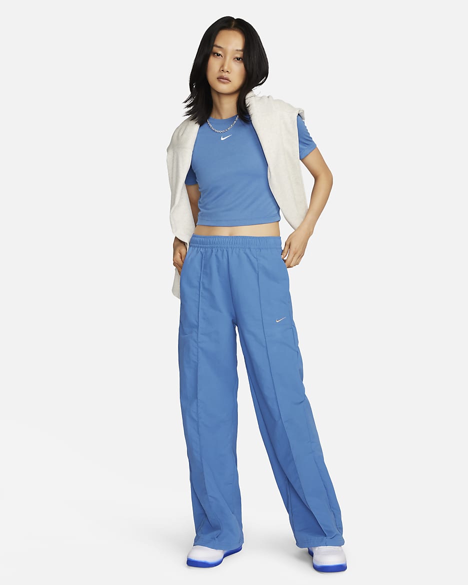 Pantaloni a vita media con bordo aperto Nike Sportswear Everything Wovens – Donna - Star Blue/Metallic Copper