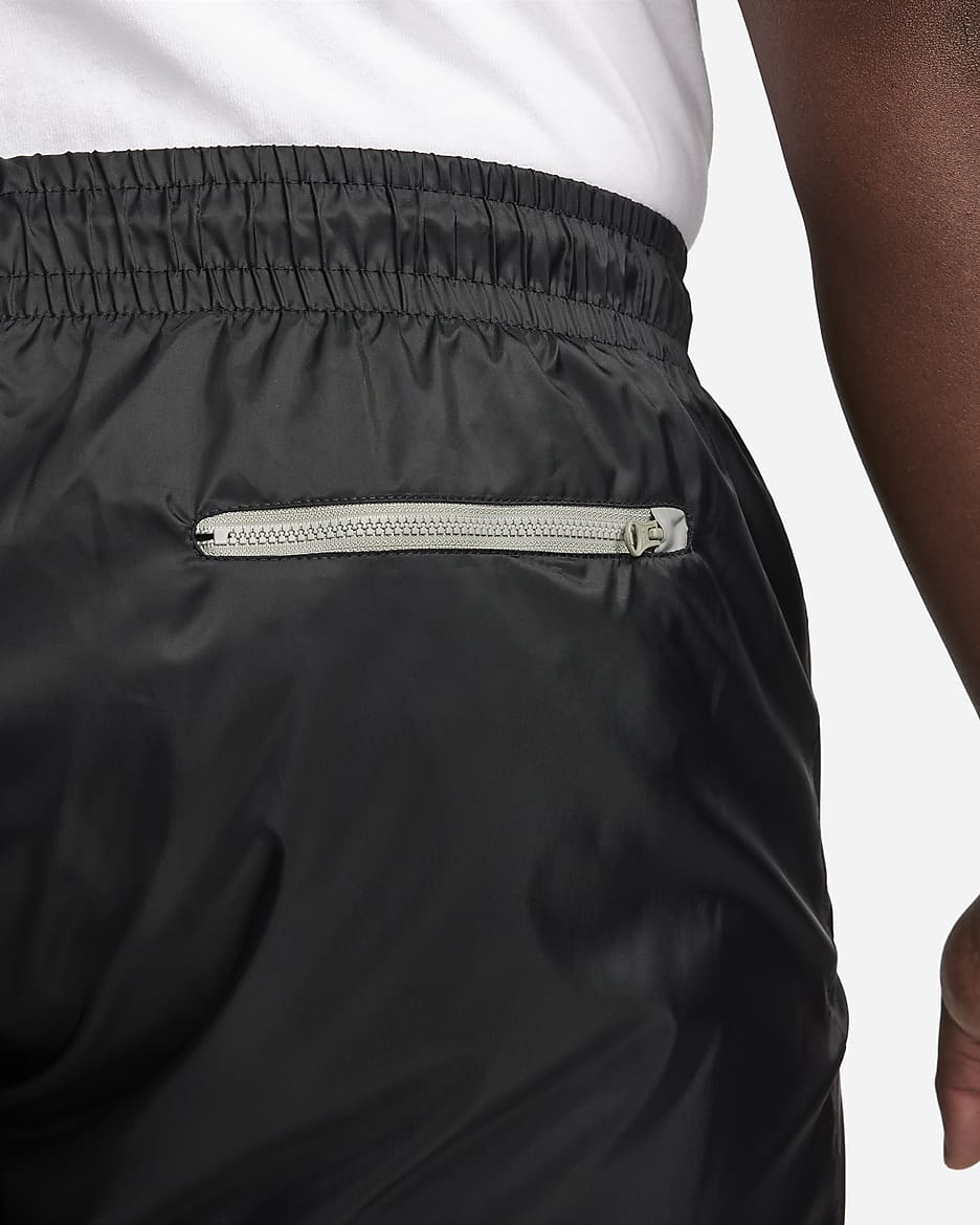 Pantalon doublé en tissu tissé Nike Windrunner pour homme - Noir/Dark Stucco/Saturn Gold