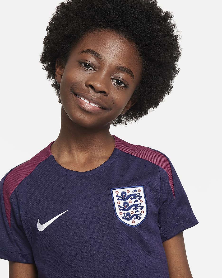 England Strike Nike Dri-FIT Kurzarm-Fußballoberteil aus Strickmaterial für ältere Kinder - Purple Ink/Rosewood/Weiß