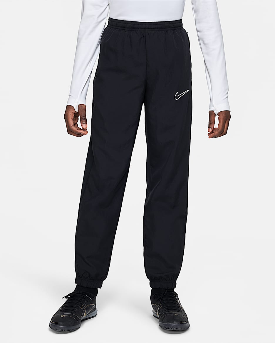 Nike Dri-FIT Academy Older Kids' Woven Football Tracksuit Bottoms (Stock) - Black/Black/White