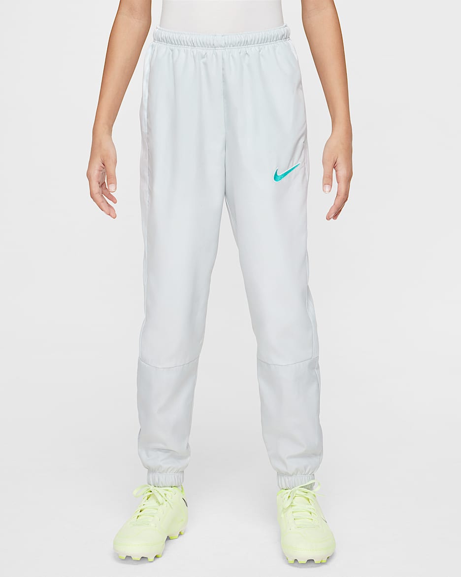 Nike Academy Older Kids' Football Tracksuit Bottoms - Photon Dust/Dynamic Turquoise