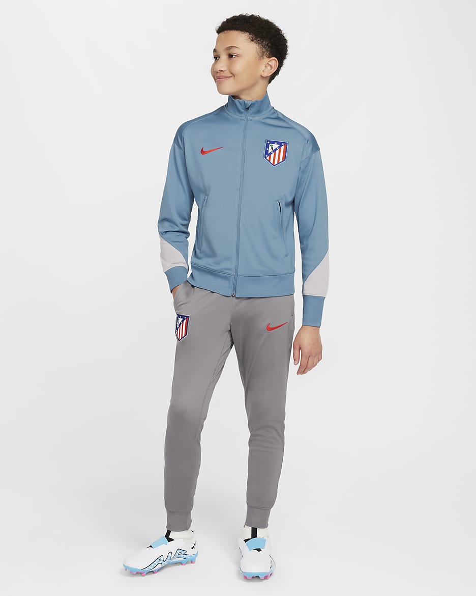 Atlético Madrid Strike Older Kids' Nike Dri-FIT Football Knit Tracksuit - Noise Aqua/Flat Pewter/Light Iron Ore/Light Crimson