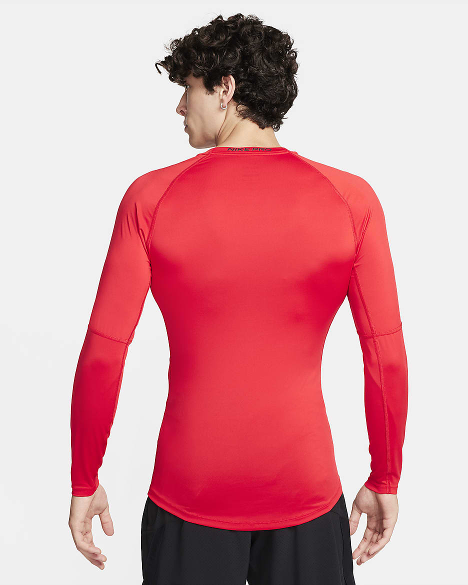 Tætsiddende Nike Pro Dri-FIT-fitnessoverdel med lange ærmer til mænd - University Red/sort