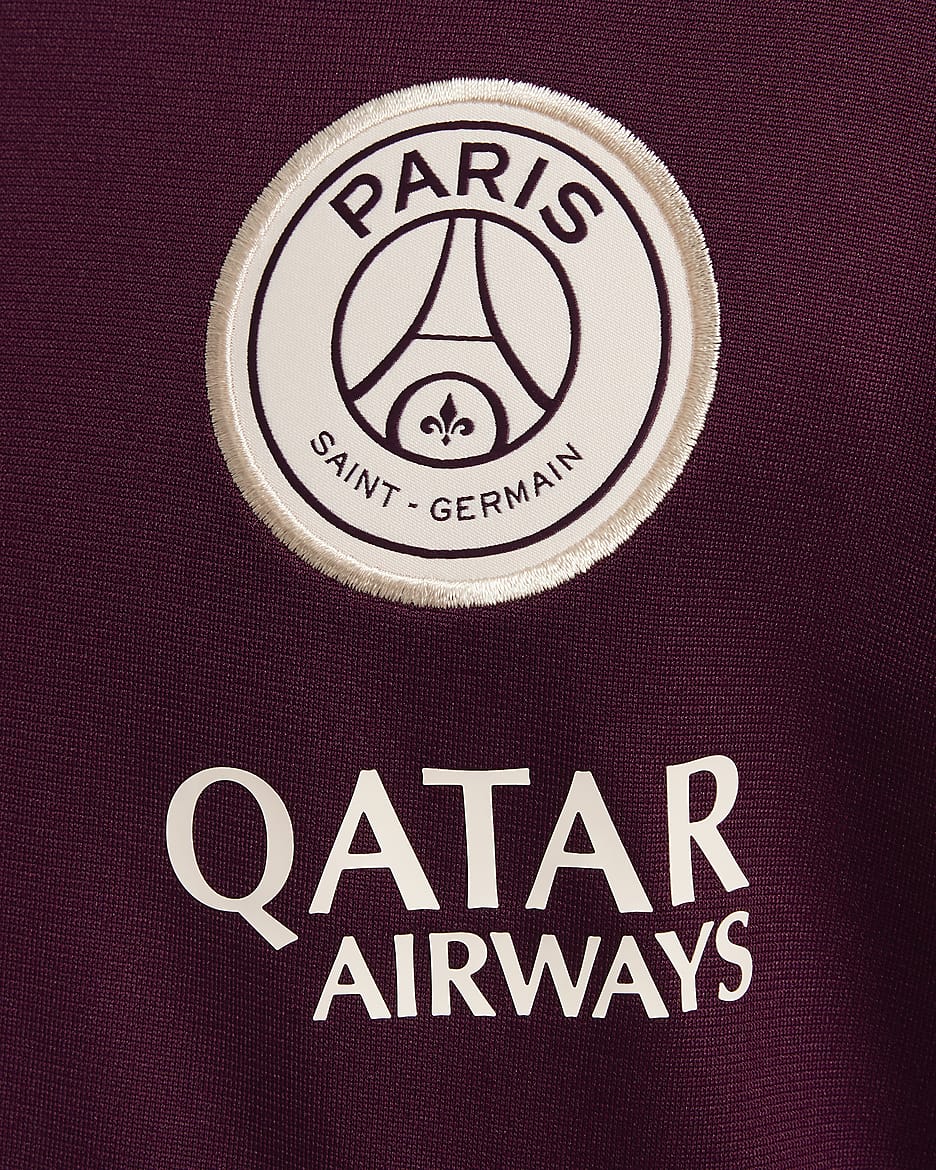 Pleteninová fotbalová tepláková souprava Nike Dri-FIT Paris Saint-Germain Strike pro větší děti - Bordeaux/Geode Teal/Guava Ice