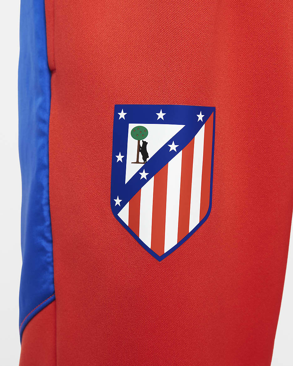 Atlético Madrid Home Older Kids' Nike Football Woven Tracksuit - Light Crimson/Game Royal/Game Royal