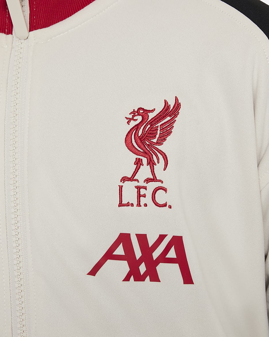 Liverpool FC Academy Pro Nike Dri-FIT voetbalvolksliedjack voor kids - Light Orewood Brown/Zwart/Gym Red