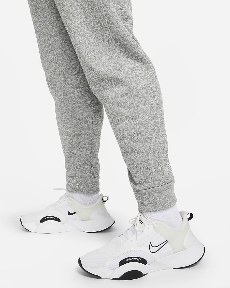 Nike Therma-FIT avsmalnet treningsbukse til herre - Dark Grey Heather/Particle Grey/Svart