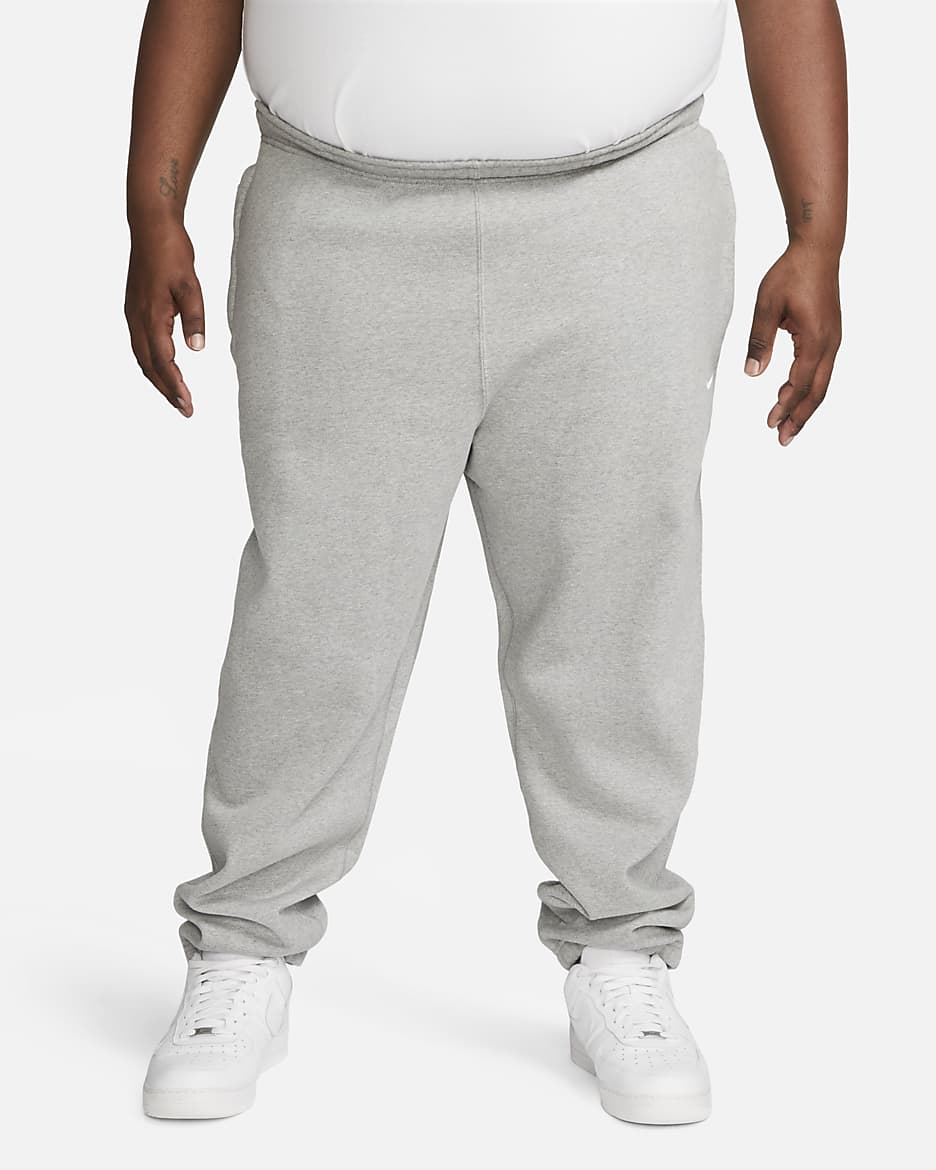 Pantalon en tissu Fleece Nike Solo Swoosh pour Homme - Dark Grey Heather/Blanc