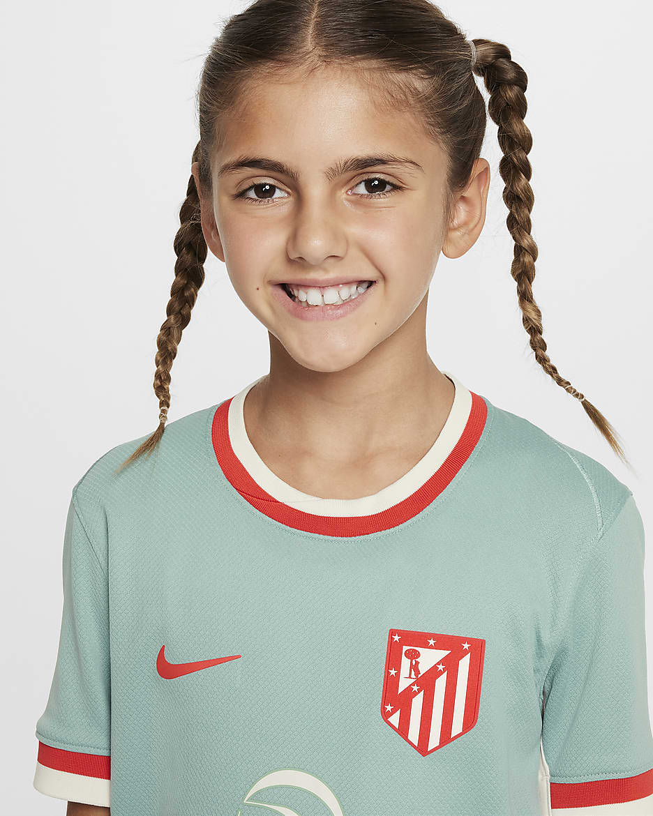 Atlético Madrid 2024/25 Stadium Away Nike Replika Fußballtrikot mit Dri-FIT-Technologie (ältere Kinder) - Cannon/Phantom/Light Crimson/Light Crimson