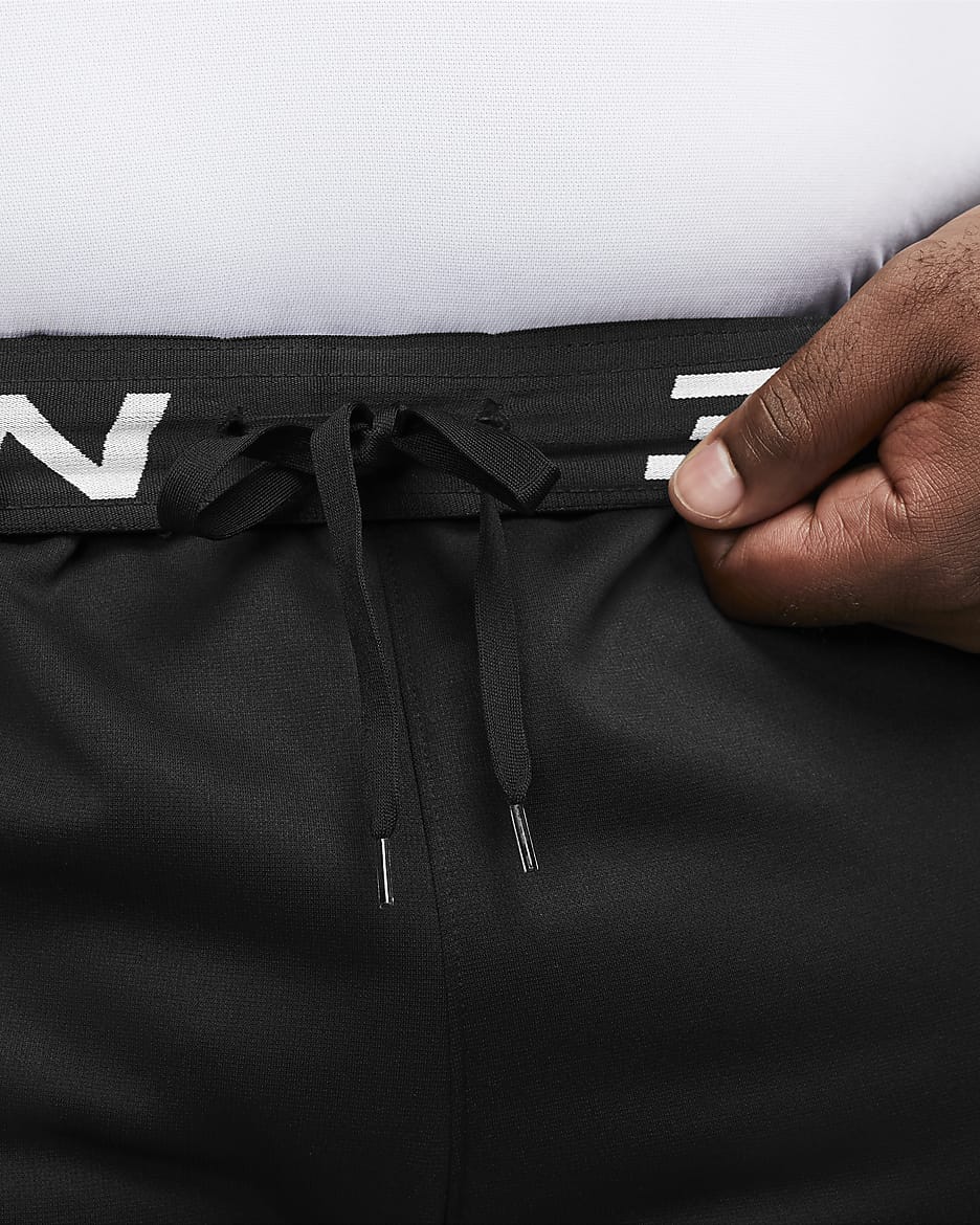 Träningsbyxor Nike Therma-FIT i avsmalnande modell för män - Svart/Svart/Vit