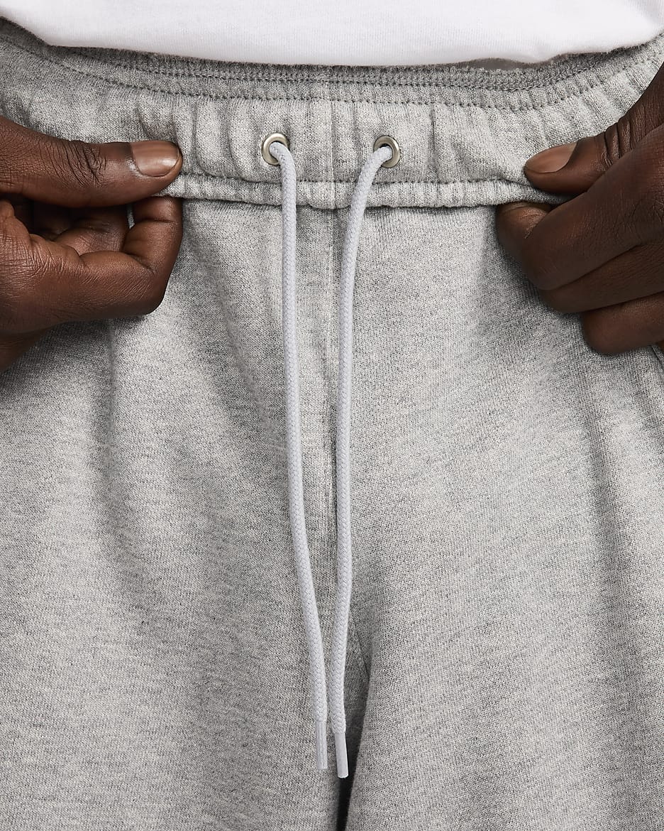 Pantalon en molleton oversize Nike Club Fleece pour homme - Dark Grey Heather/Light Smoke Grey/Blanc