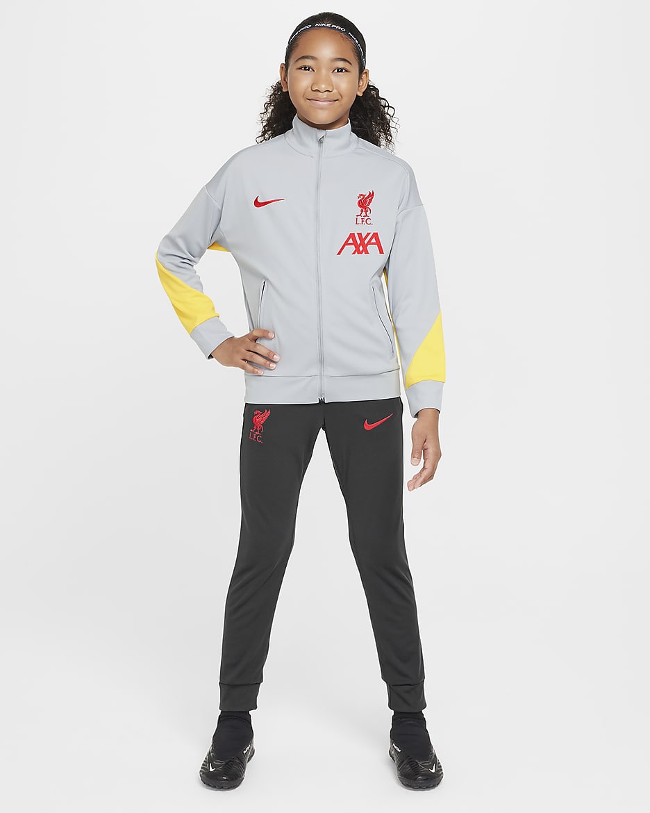 Liverpool F.C. Academy Pro Older Kids' Nike Dri-FIT Football Knit Tracksuit - Light Smoke Grey/Dark Smoke Grey/Chrome Yellow/Global Red