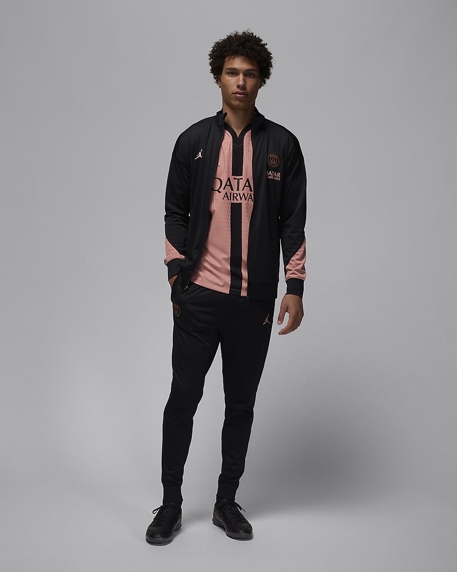 Męski dzianinowy dres piłkarski Jordan Dri-FIT Paris Saint-Germain Strike (wersja trzecia) - Czerń/Rust Pink/Rust Pink