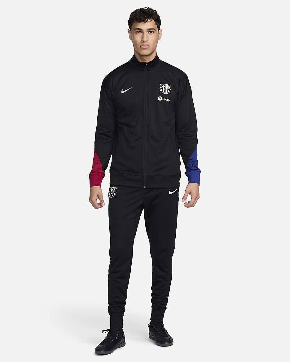 FC Barcelona Strike Nike Dri-FIT strikket fotballtracksuit til herre - Svart/Noble Red/Deep Royal Blue/Light Orewood Brown