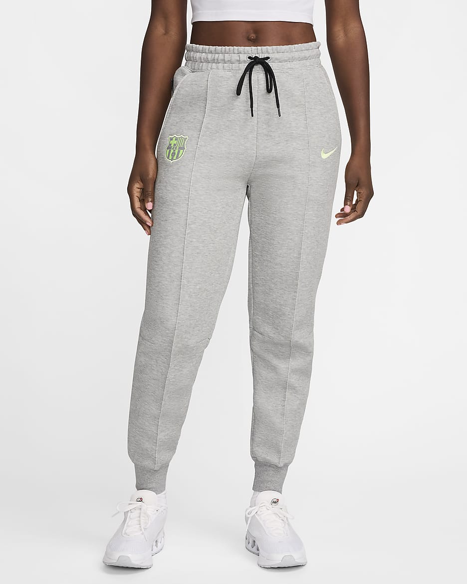 Pantalon de jogging taille mi-haute Nike Football FC Barcelone Tech Fleece pour femme - Dark Grey Heather/Barely Volt