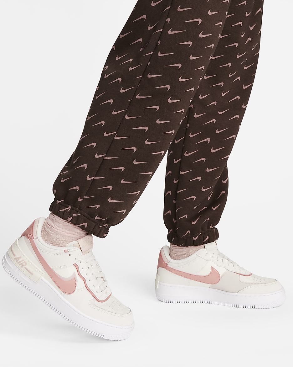 Calças de fato de treino estampadas e folgadas Nike Sportswear Phoenix Fleece para mulher - Castanho Baroque