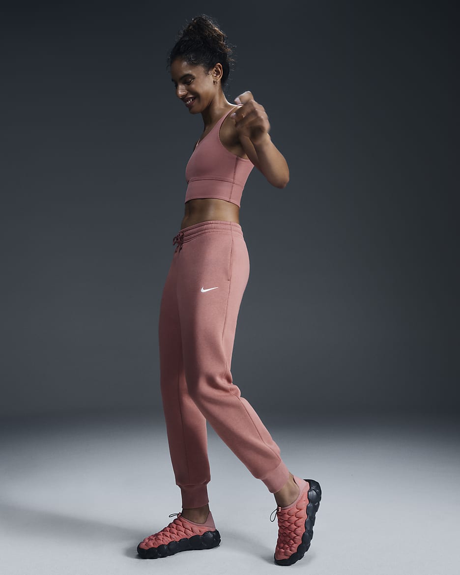 Pants de entrenamiento de tiro medio para mujer Nike Sportswear Phoenix Fleece - Rosa cañón/Vela