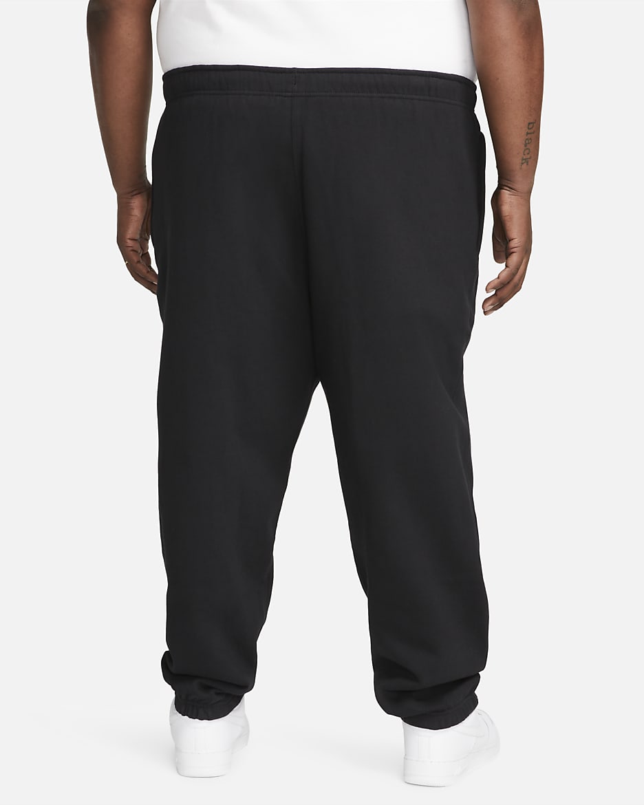 Pantalon en tissu Fleece Nike Solo Swoosh pour Homme - Noir/Blanc