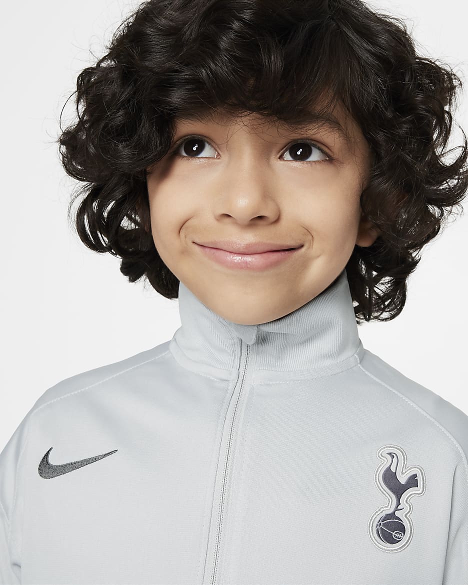 Pleteninová fotbalová sportovní souprava Tottenham Hotspur Strike Nike Dri-FIT pro malé děti - Grey Fog/Polar/Dark Grey/Dark Grey