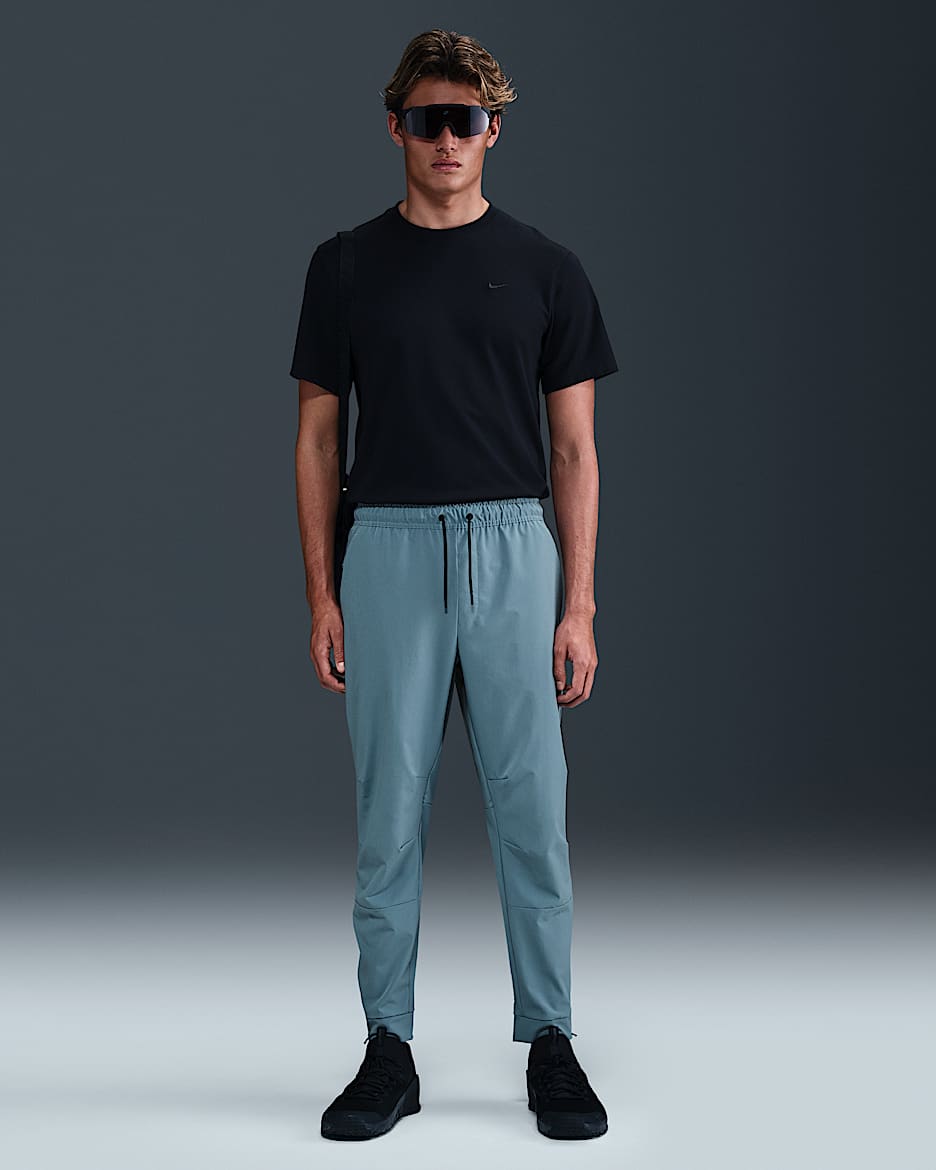 Nike Unlimited Pantalón versátil con bajos con cremallera Dri-FIT ADV - Hombre - Smokey Blue/Negro/Smokey Blue