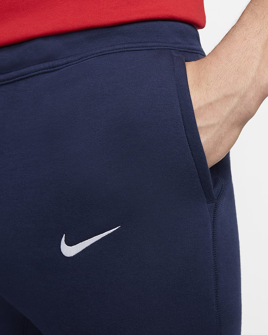 Paris Saint-Germain Tech Fleece Nike voetbalbroek voor heren - Midnight Navy/Wit