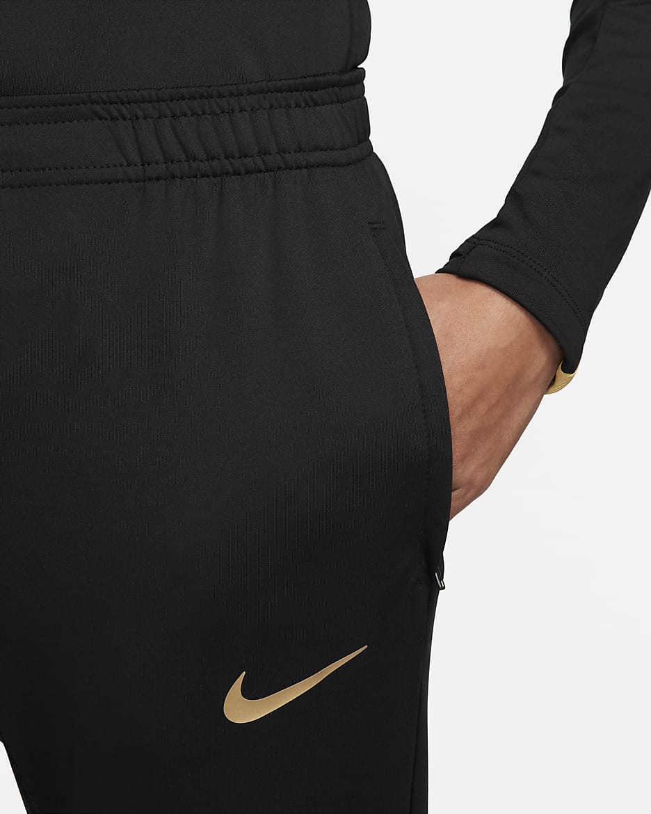 Nike Strike Dri-FIT fotballbukse til dame - Svart/Jersey Gold/Metallic Gold