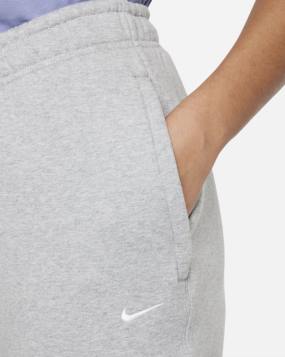 Nike Solo Swoosh Fleecebroek voor dames - Dark Grey Heather/Wit