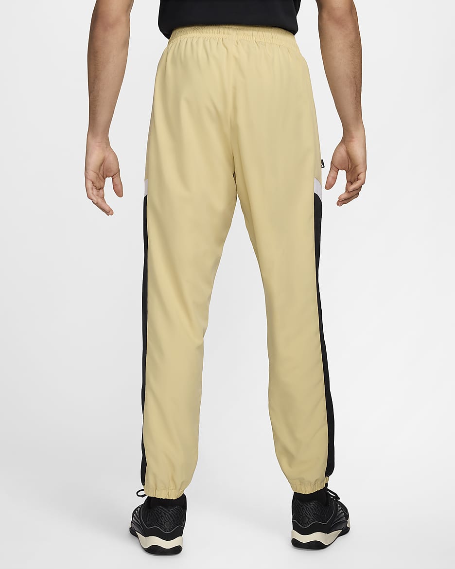 Pantaloni in tessuto da basket Nike Icon – Uomo - Team Gold/Nero/Bianco/Nero