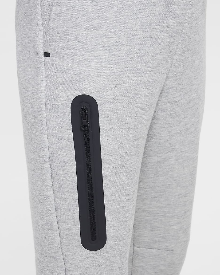 Běžecké kalhoty Nike Sportswear Tech Fleece pro větší děti (dívky) - Dark Grey Heather/Černá/Černá/Černá