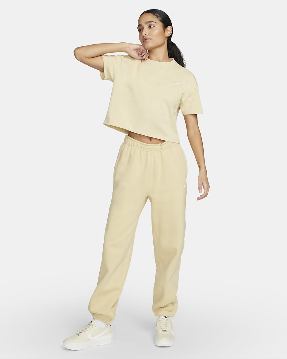 Pantaloni in fleece Nike Solo Swoosh - Donna - Team Gold/Bianco