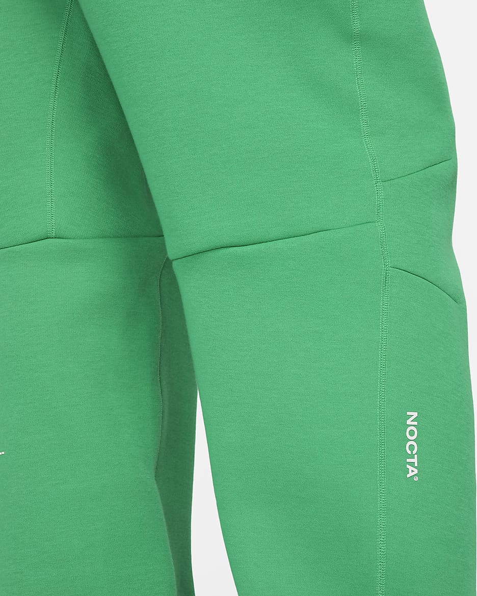 Pantalon de survêtement à ourlet ouvert NOCTA Tech Fleece pour homme - Stadium Green/Sail