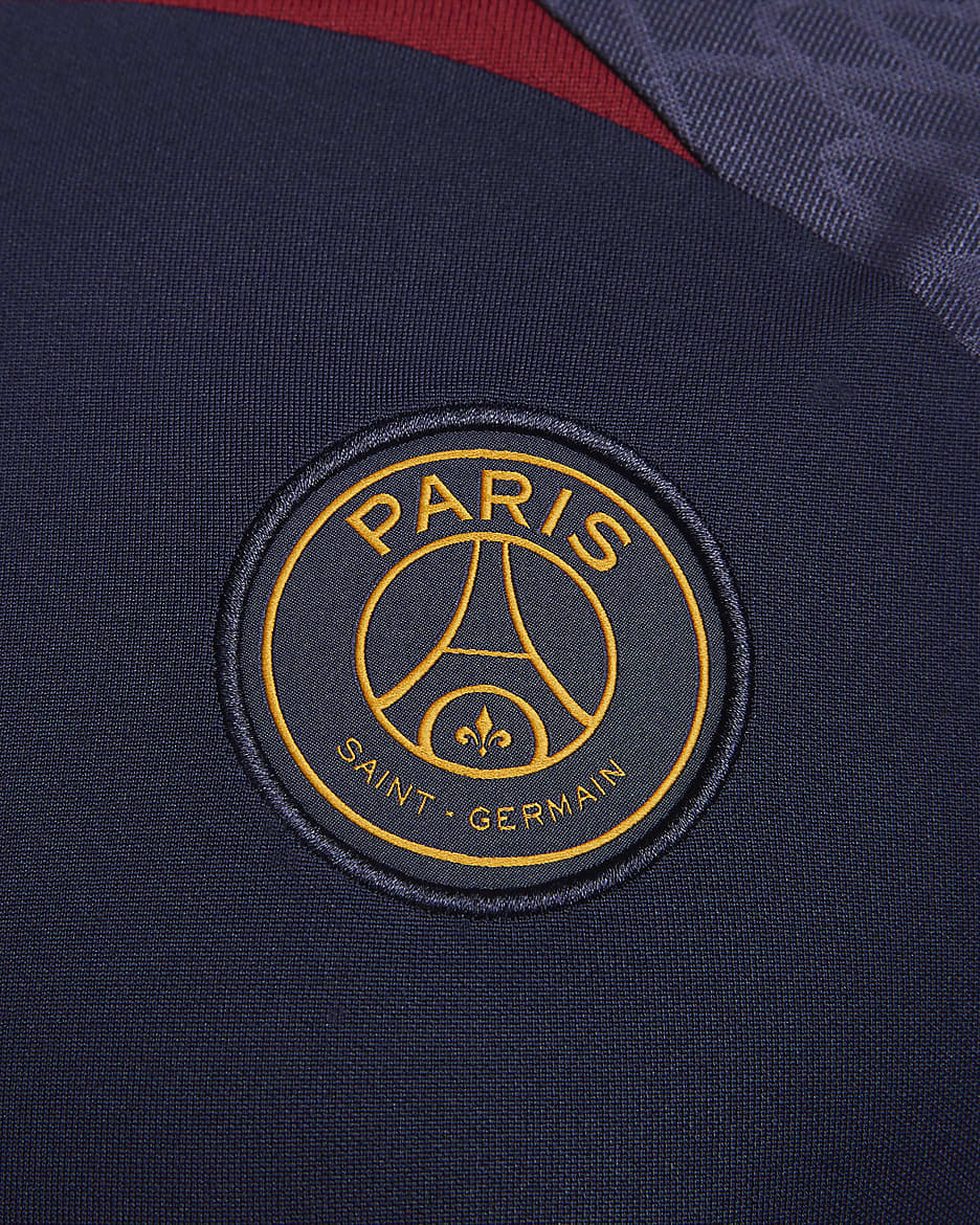 Paris Saint-Germain Strike Men's Nike Dri-FIT Knit Soccer Top - Blackened Blue/Blackened Blue/Team Red/Gold Suede