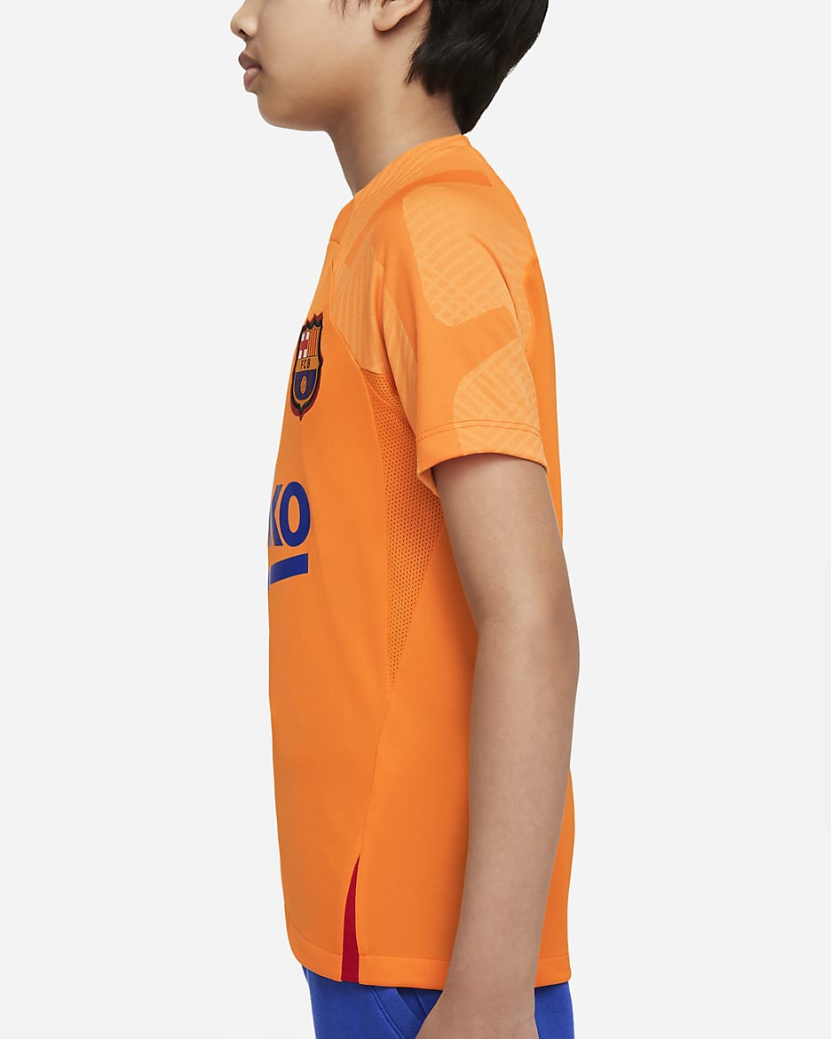 FC Barcelona Strike 大童 Nike Dri-FIT 短袖足球上衣 - Vivid Orange/University Red/黑色